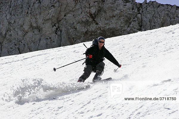 Touring skier using fun carving skies on snow field on mountain Rax Lower Austria Austria