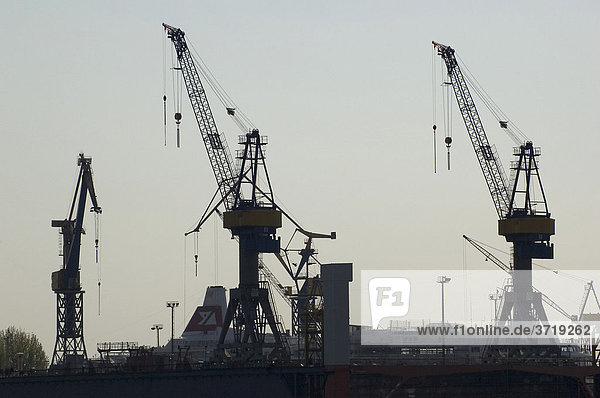 Cranes at the dockyard of Blohm and Voss at Hamburg Harbour Germany