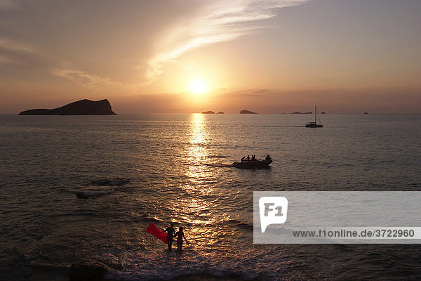 Sunset in Cala Comte near Sant Josep with view to the island S¥ Espartar
