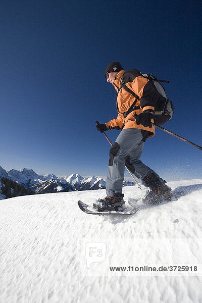 Snowshoe walker and the Karwendel Range  Tyrol  Austria