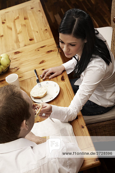 Young couple having breakfast together