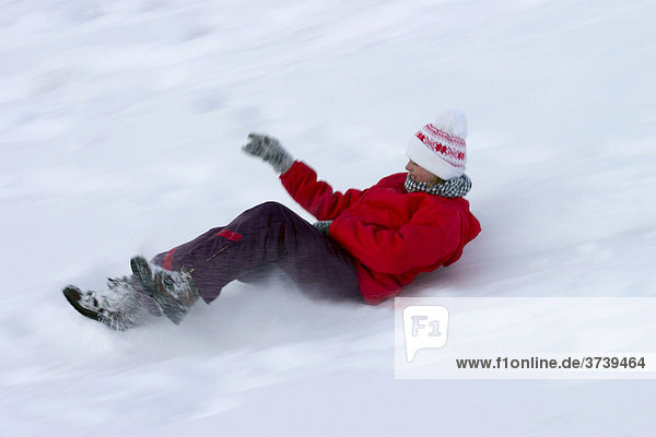 Girl 12 years old riding on snow-slider  Dolomites  Italy  Europe