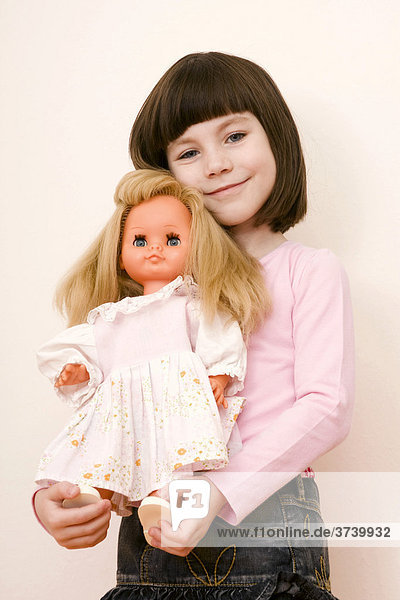 Little girl  6 years  with doll