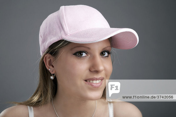 Young woman wearing a baseball cap  portrait