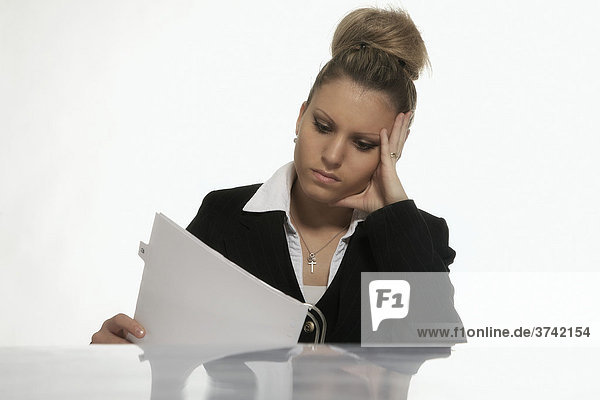 Businesswoman studying documents