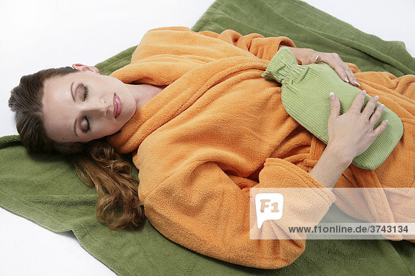 Woman with a hot-water bottle