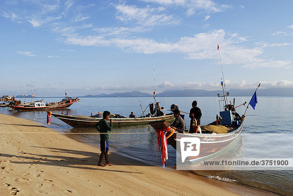 Fishing boats at the beach in morning light  island Kho Samui  Thailand