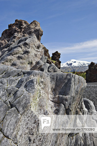 Rock formations along the coast at DjupalÛnssandur Snaefellsness Peninsula Iceland Atlantic Ocean