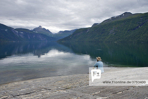 Person enjoying the landscape at Lang Fjord  Boggestranda  M¯re og Romsdalen  Norway  Scandinavia  Europe