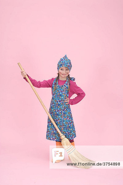 Young girl dressed as a cleaning lady