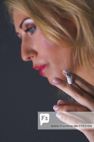 Woman enjoys a cigarette