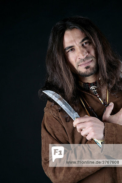 Man wearing indian clothing  knife