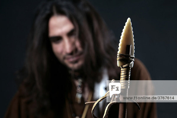 Man wearing indian clothing  arrow