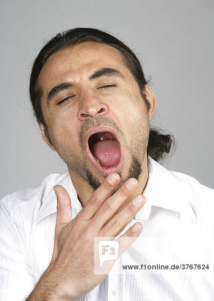 Portrait of a man  yawning
