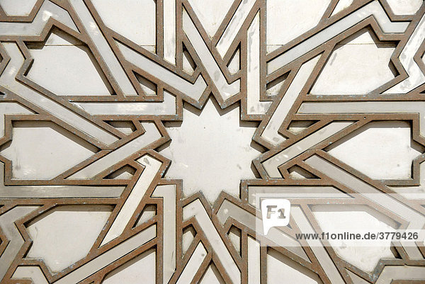 Symmetric pattern star iron portal of mosque Hassan II Casablanca Morocco