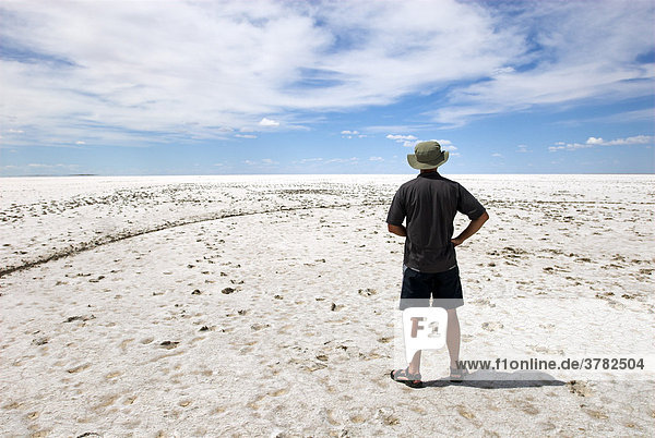 Man on the salt Lake Eyre  South Australia  Australia