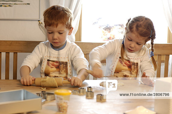 Children are baking cookies for christmas