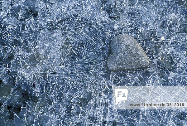 Heart-shaped stone encased in ice