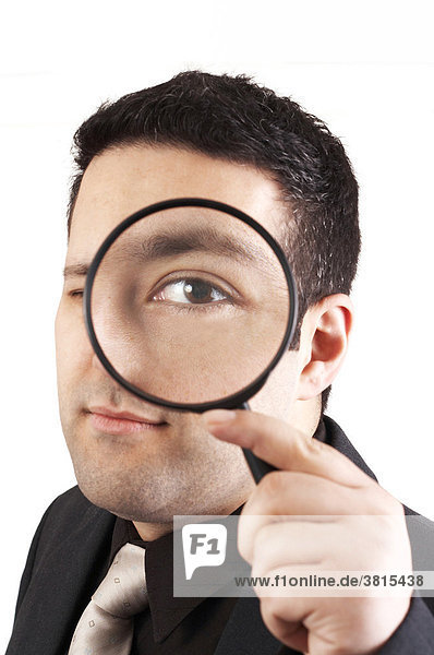 Man with a magnifier glass. The auditor