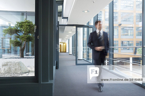 Man walking through a banking building