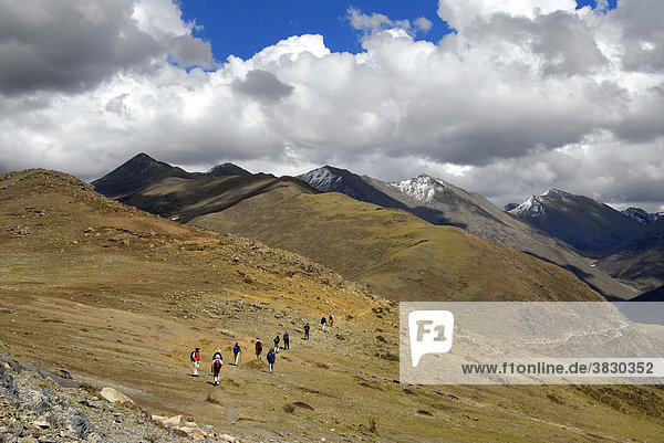 Trekking group on the old pilgrim path through high mountains from Ganden Monastery to Samye Tibet China
