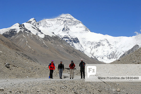 Four trekker side by side in front of Mt. Everest Chomolungma Everest Base Camp Tibet China