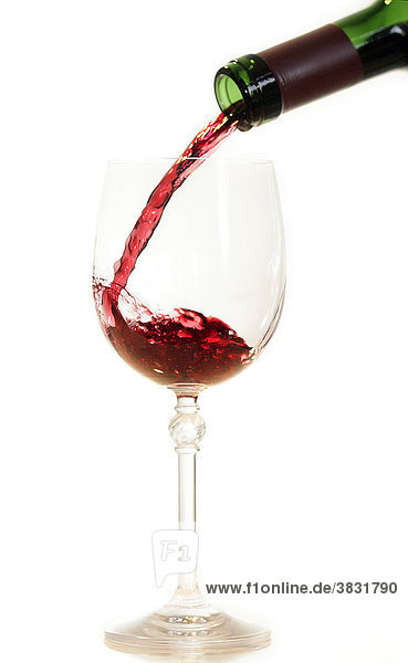 Pouring red wine in glass