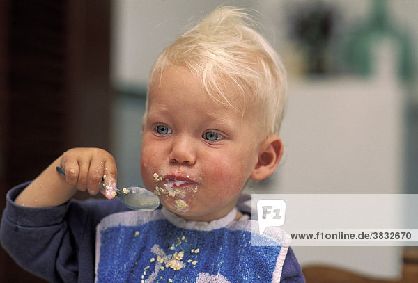 One-year-old eating muesli