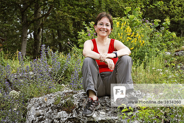 Woman at Kopffelsen rocks near Mühlbach   Upper Palatinate Bavaria Germany