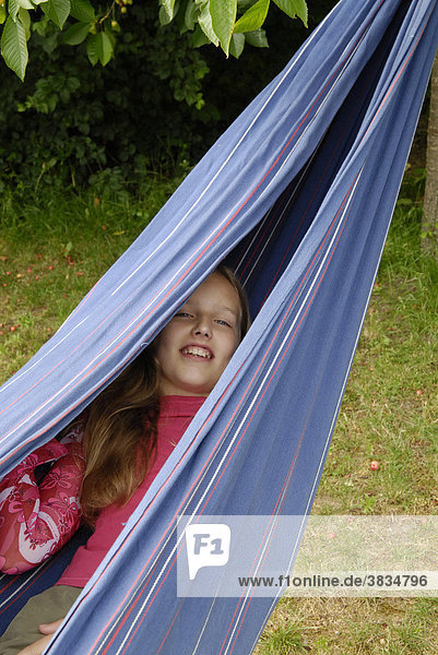 Girl is situated in hammock