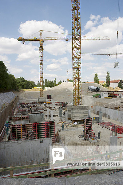 Building site with two cranes in München Johanneskirchen