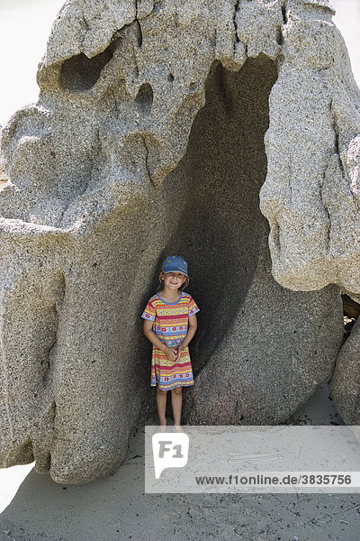 Little girl in rockniche  Costa Rei  Sardinia  Italy