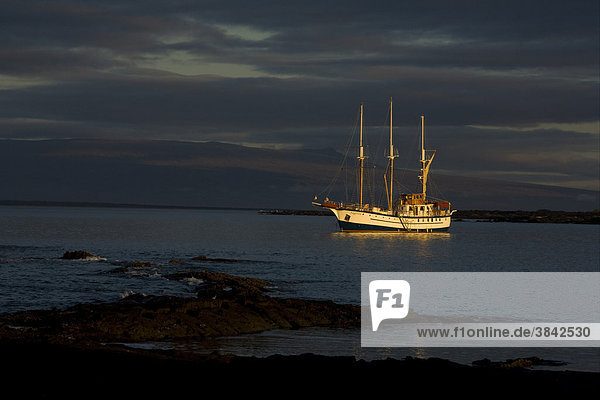 Old schooner Sagitta at anchor  late evening  off Fernandina Island  Galapagos