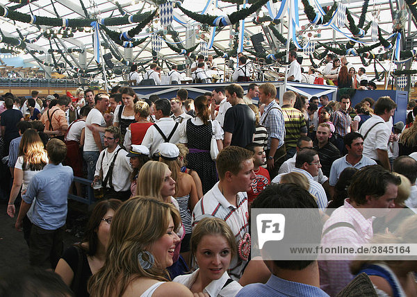 People revelling in a beer tent at the Oktoberfest festival  Munich  Bavaria  Germany  Europe