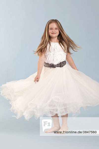 Girl  8 years  in a white dress