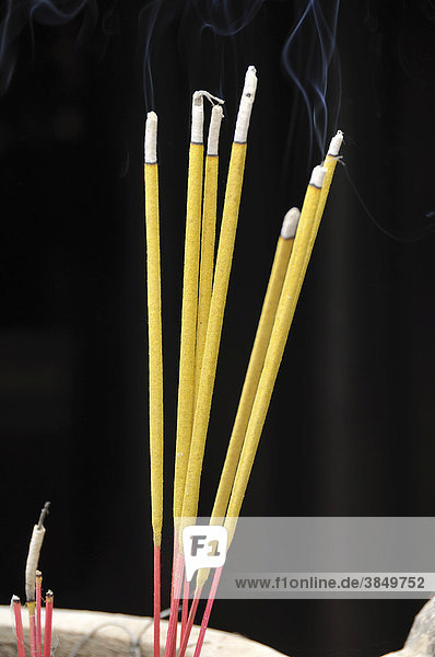 Incense sticks as sacrificial offering in a temple  Hanoi  Vietnam  Southeast Asia