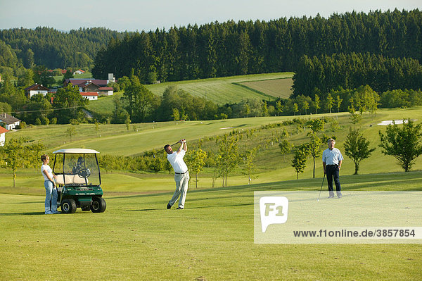 Golfers  golf course  Pleiskirchen  Altoetting  Upper Bavaria  Bavaria  Germany  Europe