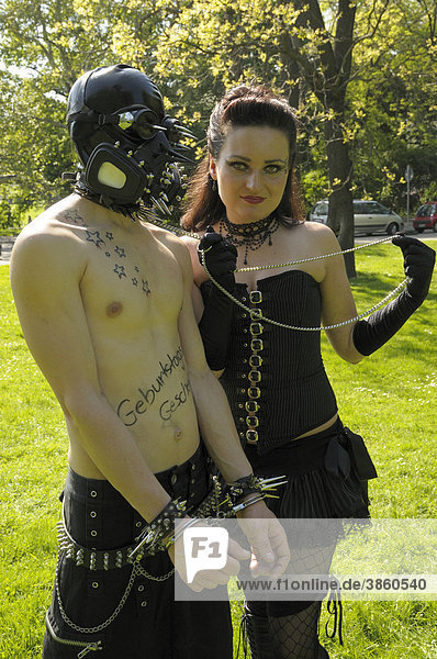 Couple with handcuffs  BDSM  Wave Gothic Treffen music festival  Leipzig  Saxony  Germany  Europe