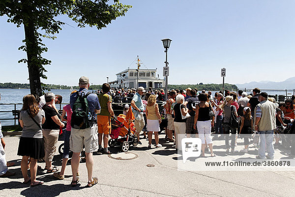 Tourists boarding a ferry  Prien Stock  lake Chiemsee  Chiemgau  Upper Bavaria  Germany  Europe