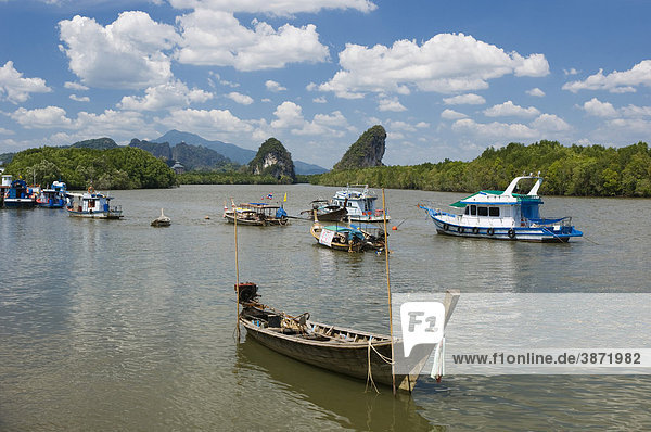 Asia  asian  boat  boats  bodies  body  countryside  day  daylight  daytime  during  East  exterior  exteriors  Fishing  fishing  fluvial  formation  formations  Krabi  landscape  landscapes  limestone  nature  nobody  of  outdoor  photo  photos  river  River  rivers  rock  rocks  scenery  scenic  shape  shaped  shapes  shot  shots  South  South-East  thai  Thailand  the  topography  Town  vessel  vessels  water  waters