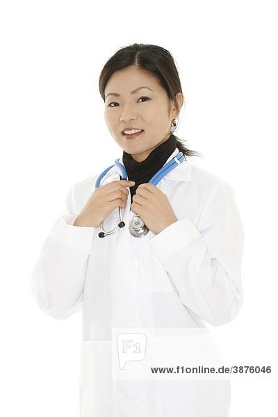 Beautiful Asian doctor or nurse on a white background