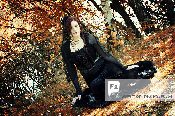Women  gothic  seated  serious
