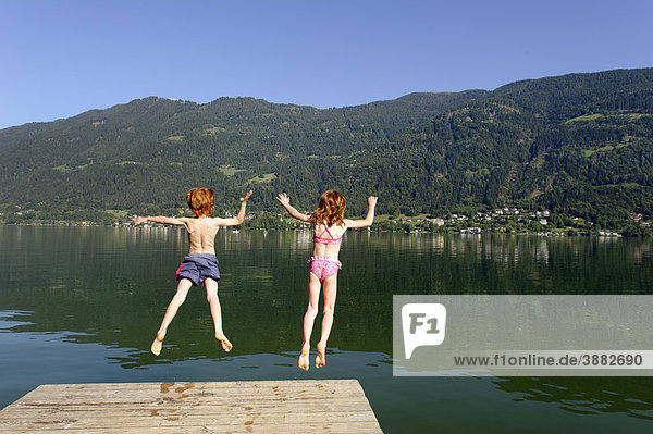 Swimming  bathing on Ossiacher See lake  south bank  with Mt. Gerlitzen  Carinthia  Austria  Europe