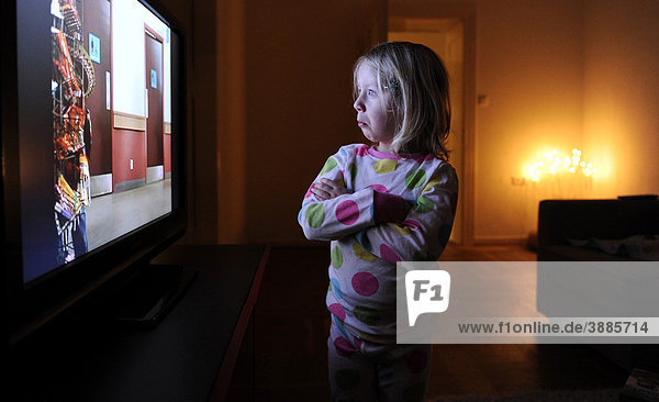 Little girl watching television