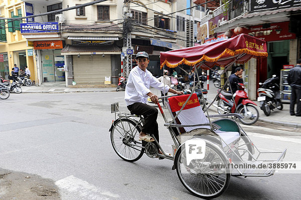 Street scene with a bicycle rickshaw  Hanoi  North Vietnam  Vietnam  Southeast Asia  Asia