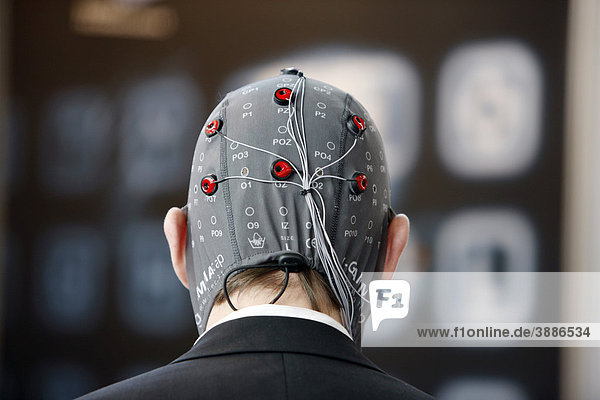 Control of machines and computers through brain activity  electrodes on the scalp detect brain activity and give signals to a technical device in order to control it  Computer and IT trade fair Cebit  Hanover Messe  Trade Fair  Hanover  Lower Saxony  Germany  Europe