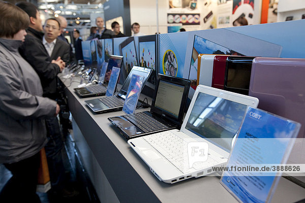 Visitors looking at laptops  Internationale Computermesse CEBIT international computer fair  Hannover  Lower Saxony  Germany  Europe