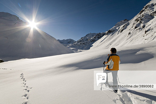 Man walking with snowshoes  Rifflsee  Pitztal  Tyrol  Austria  Europe