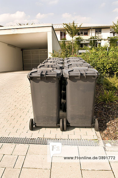 New garbage cans in front of a modern house  Munich  Bavaria  Germany  Europe