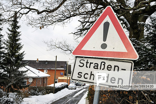 Hard winter  traffic sign Strassenschaeden road damage